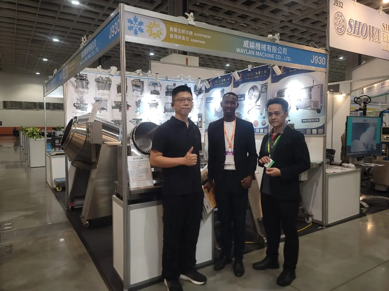 With exhibitors at a food-processing machinery stand